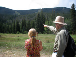 Dave Hallock points out existing ski runs and lifts as well as proposed runs and lifts to Tehri Parker.